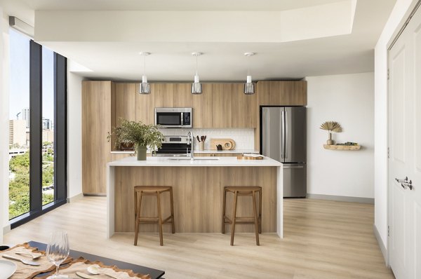 Modern kitchen with stainless steel appliances at The Waller Apartments, Greystar luxury infill community in vibrant urban location