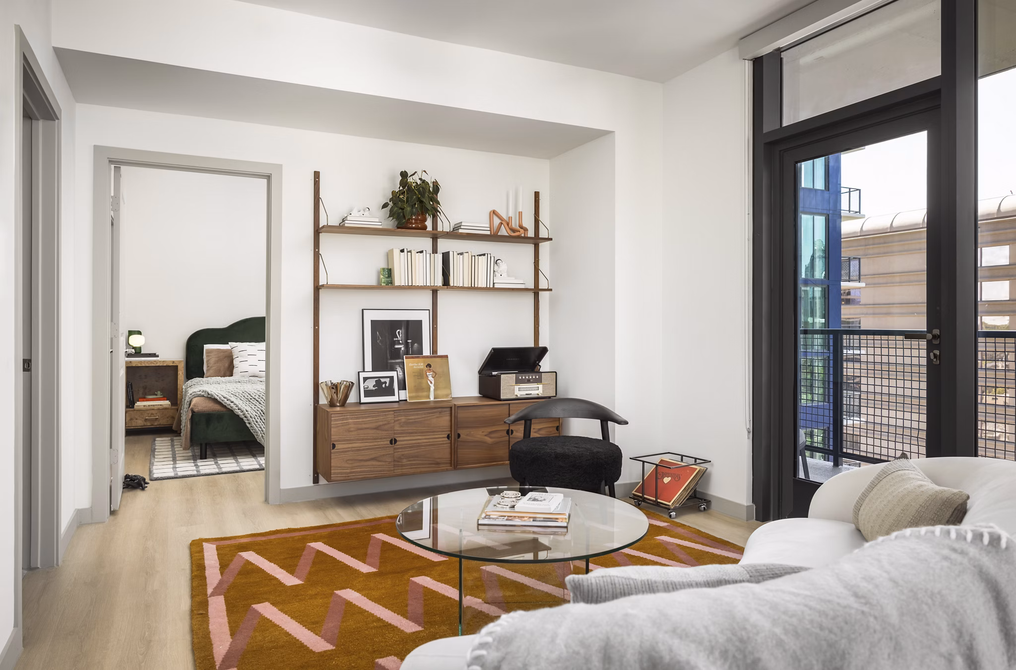 Spacious living room with modern decor in The Waller Apartments, offering luxury living by Greystar
