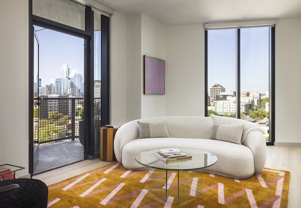 Spacious living room with modern decor at The Waller Apartments, offering luxury living in a Greystar community