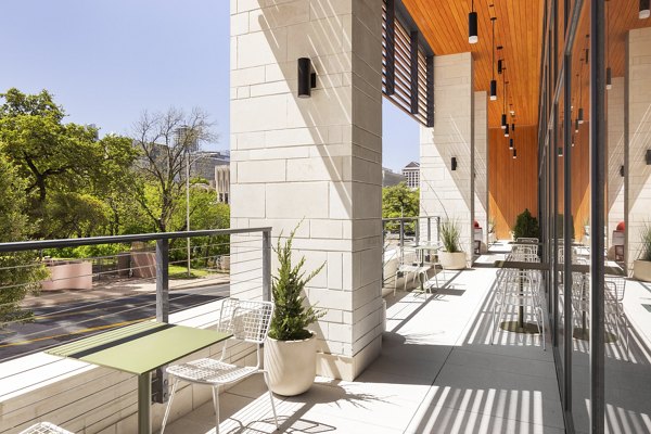 Chic outdoor patio area with seating at The Waller Apartments