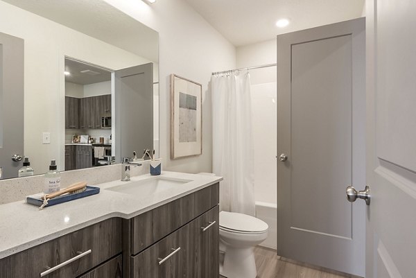 Modern bathroom with sleek fixtures in H2O Townhomes Apartments, offering luxury living in a vibrant community