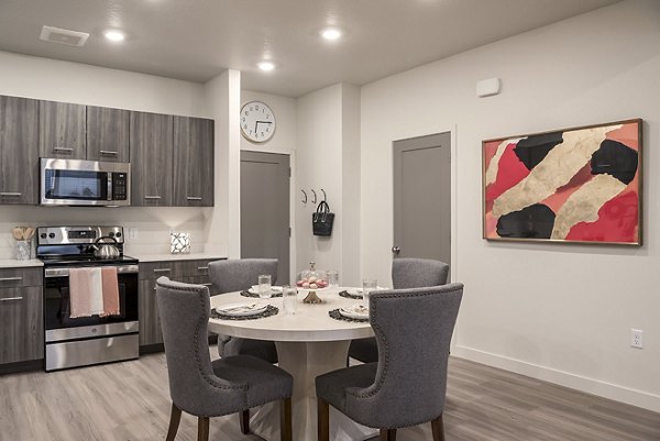 Dining area featuring modern design and ample seating in H2O Townhomes Apartments luxury apartments