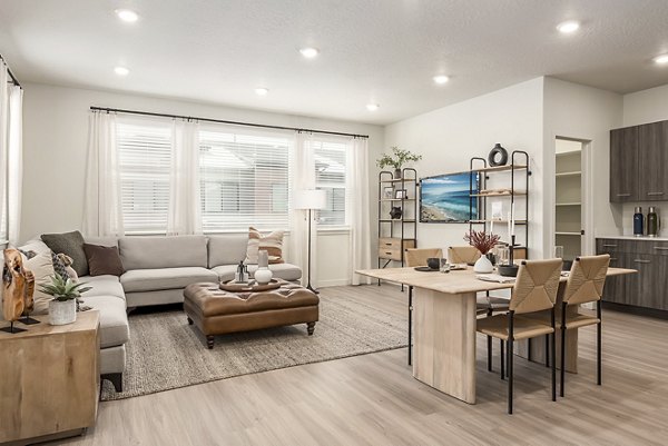 Open-concept kitchen and living area with sleek countertops at San Fernando Building Apartments