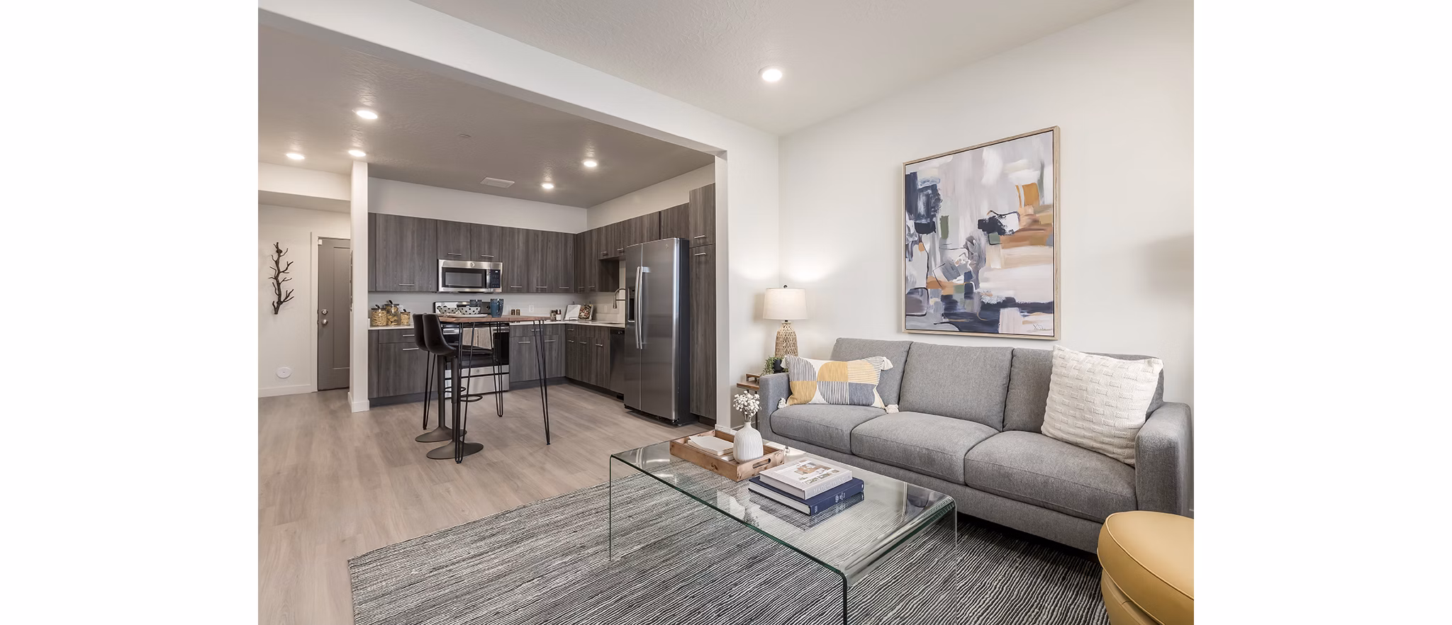 Spacious living room with modern decor in H2O Townhomes Apartments