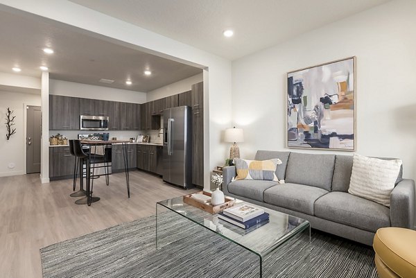 Spacious living room with modern decor in H2O Townhomes Apartments