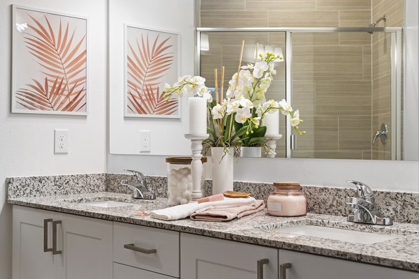 Mira Crystal Lake Apartments: Modern bathroom with elegant fixtures and marble countertops