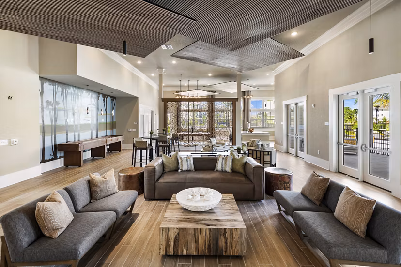 Clubhouse lounge with modern seating and entertainment options at Mira Crystal Lake Apartments