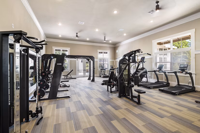 Modern fitness center with top-of-the-line equipment at Mira Crystal Lake Apartments