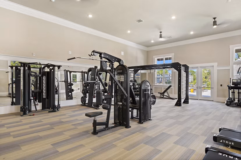 Fitness center with modern equipment at Mira Crystal Lake Apartments
