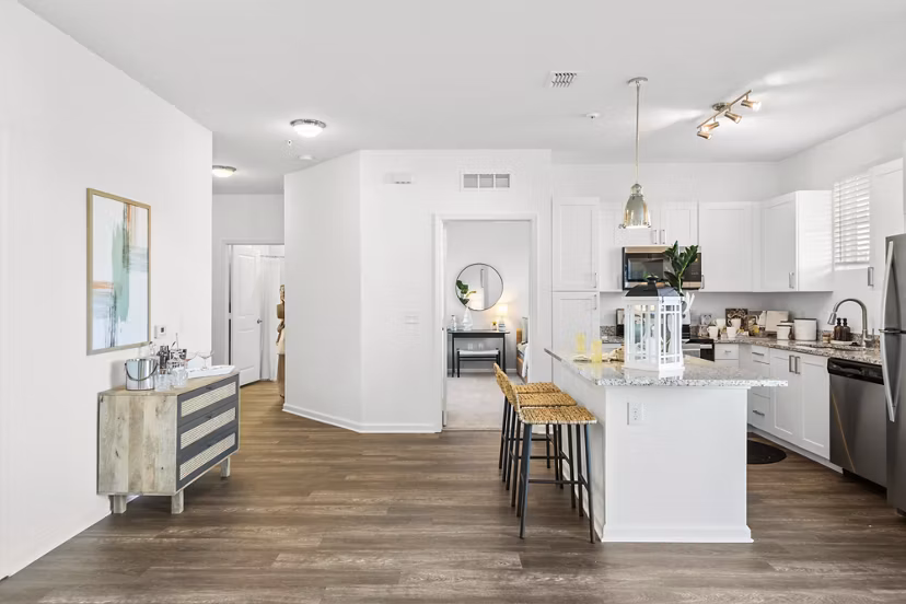 Spacious kitchen with modern appliances and granite countertops in Mira Crystal Lake Apartments
