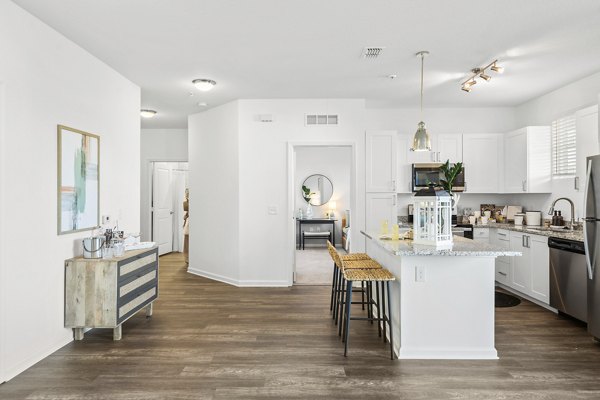 Spacious kitchen with modern appliances and granite countertops in Mira Crystal Lake Apartments