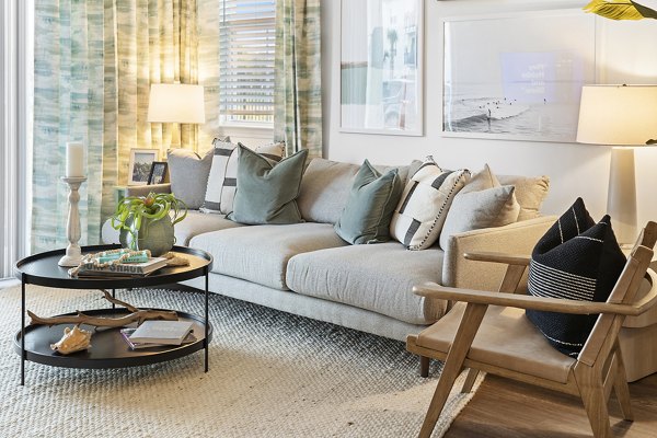 Living room featuring modern decor and large windows at Mira Crystal Lake Apartments