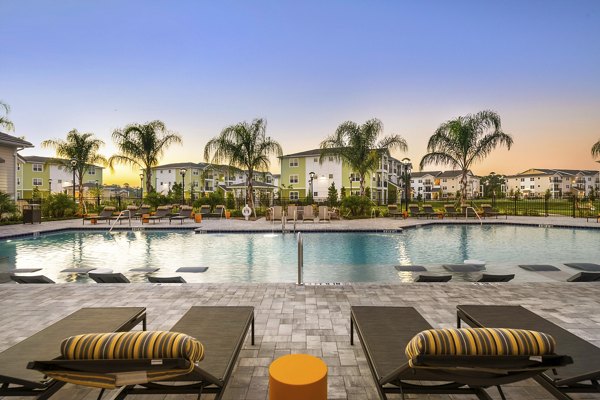 Luxurious poolside lounging at Mira Crystal Lake Apartments with scenic views