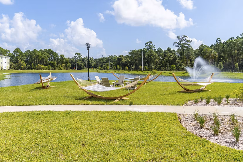 Mira Crystal Lake Apartments: Courtyard with modern landscaping and seating areas