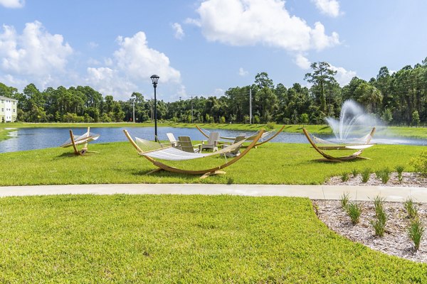 Mira Crystal Lake Apartments: Courtyard with modern landscaping and seating areas