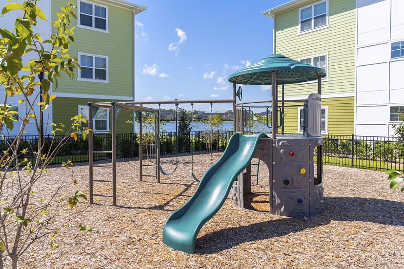 Playground featuring modern equipment at Mira Crystal Lake Apartments in a serene neighborhood