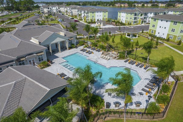 Exterior view of luxury apartments surrounded by lush landscape at Mira Crystal Lake Apartments
