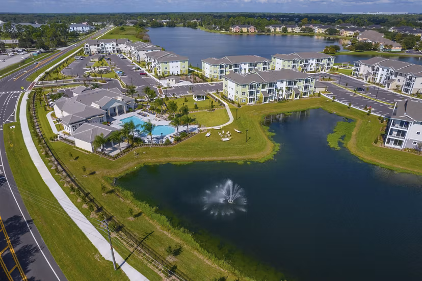 Mira Crystal Lake Apartments: Scenic view of lakeside luxury apartments in a tranquil setting