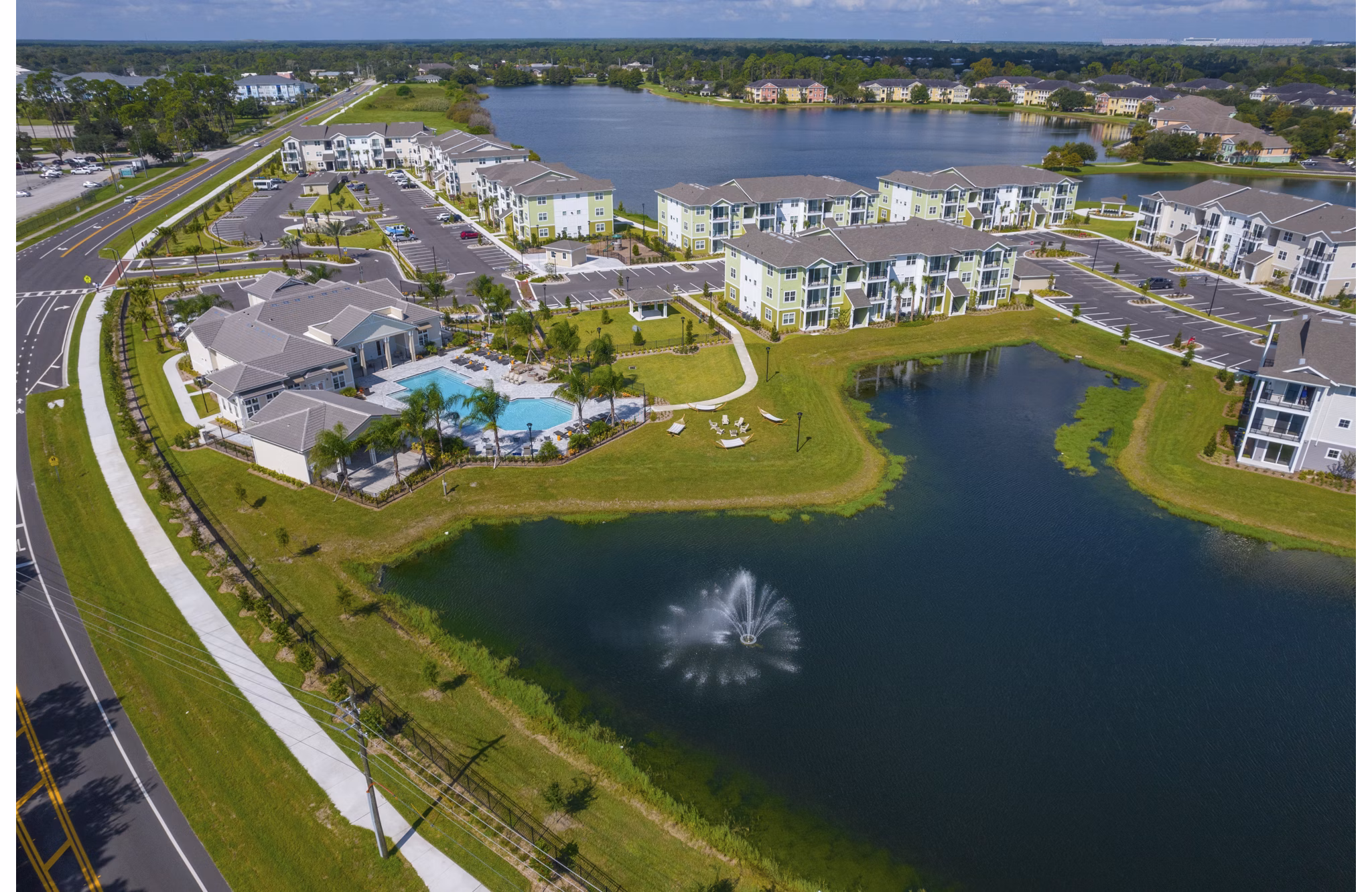 Mira Crystal Lake Apartments: Scenic view of lakeside luxury apartments in a tranquil setting