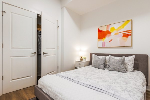 Spacious bedroom with modern decor at The Bedford Apartments