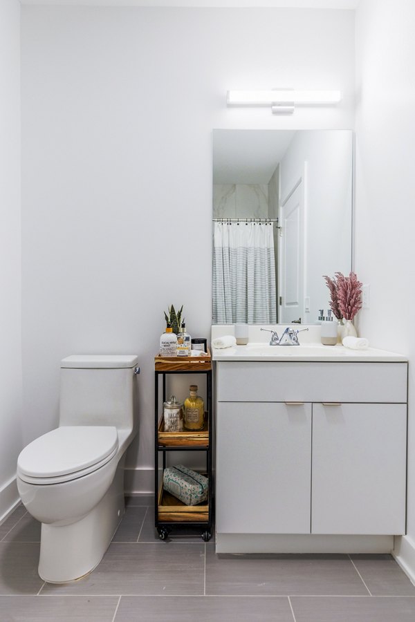 Modern bathroom featuring sleek fixtures at BELA Apartments, luxury living in Bayonne, NJ