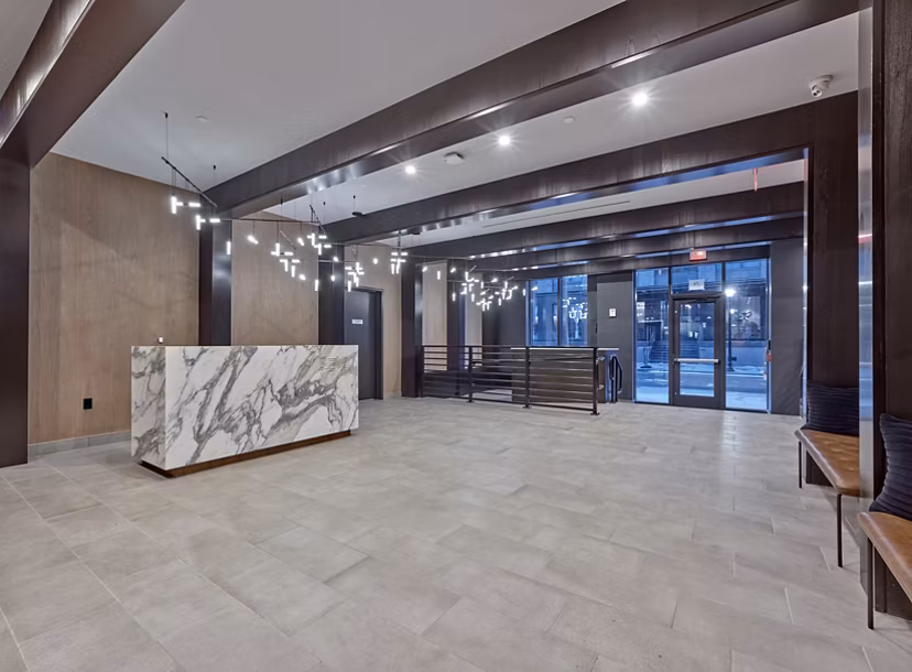 Modern clubhouse with cozy seating and entertainment options at BELA Apartments