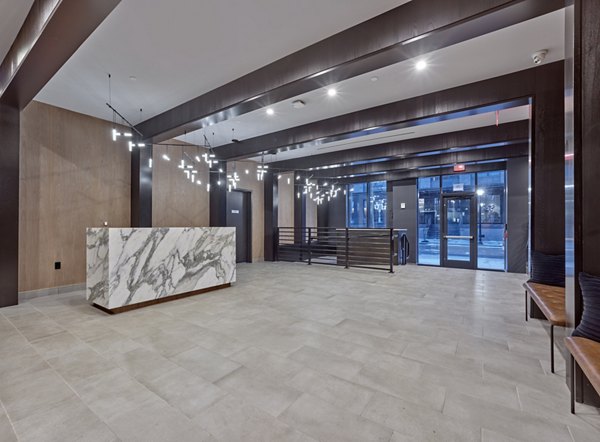 Modern clubhouse with cozy seating and entertainment options at BELA Apartments