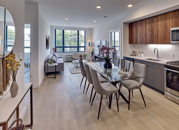 Dining area with modern dÃ©cor at BELA Apartments featuring stylish furnishings and ample natural light