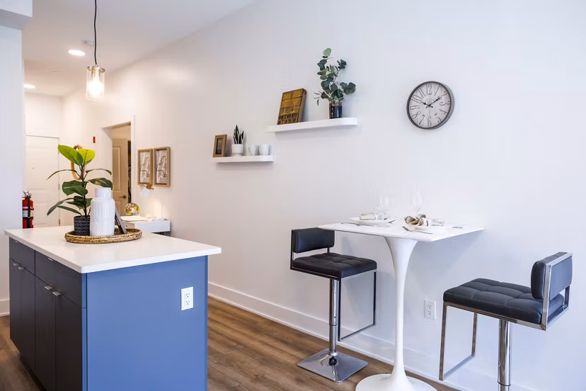 Dining room featuring elegant decor and modern lighting at The Bedford Apartments