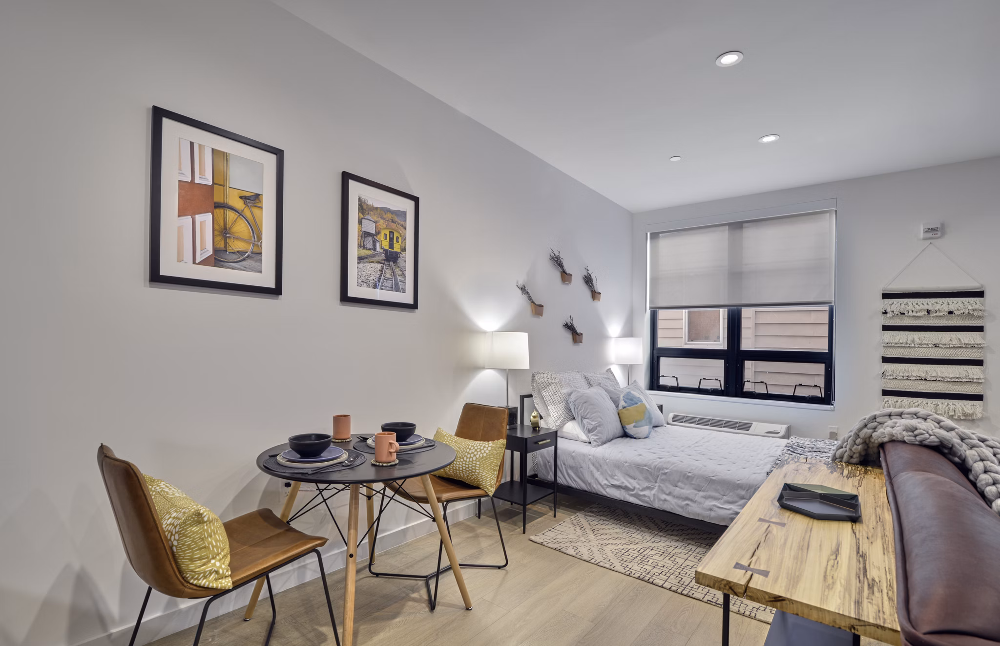 Elegant dining area with modern furnishings at BELA Apartments, offering luxury living in urban surroundings