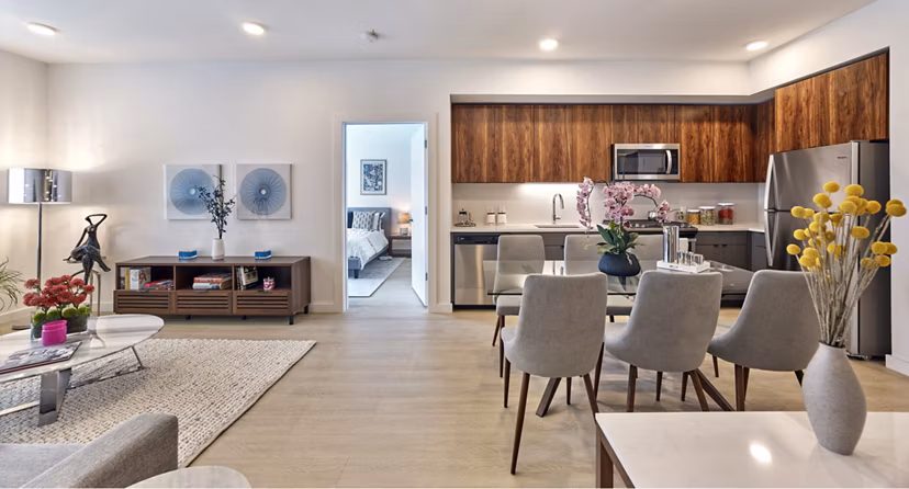 Modern kitchen with stainless steel appliances at BELA Apartments