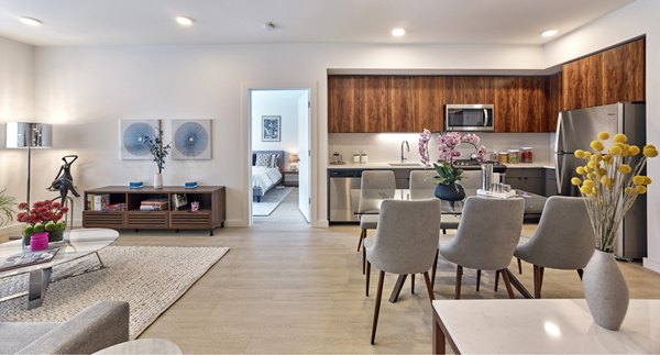 Modern kitchen with stainless steel appliances at BELA Apartments