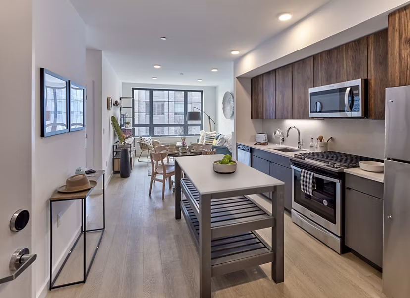 Modern kitchen with stainless steel appliances at BELA Apartments