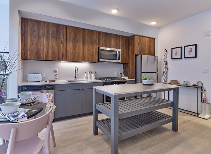 Modern kitchen with stainless steel appliances at BELA Apartments, luxury living in the heart of the community