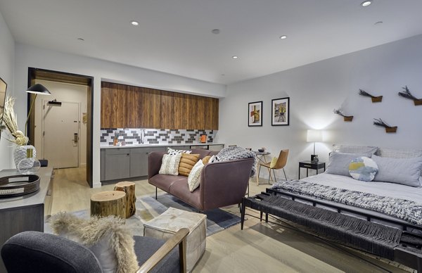 Spacious living room with modern decor at BELA Apartments