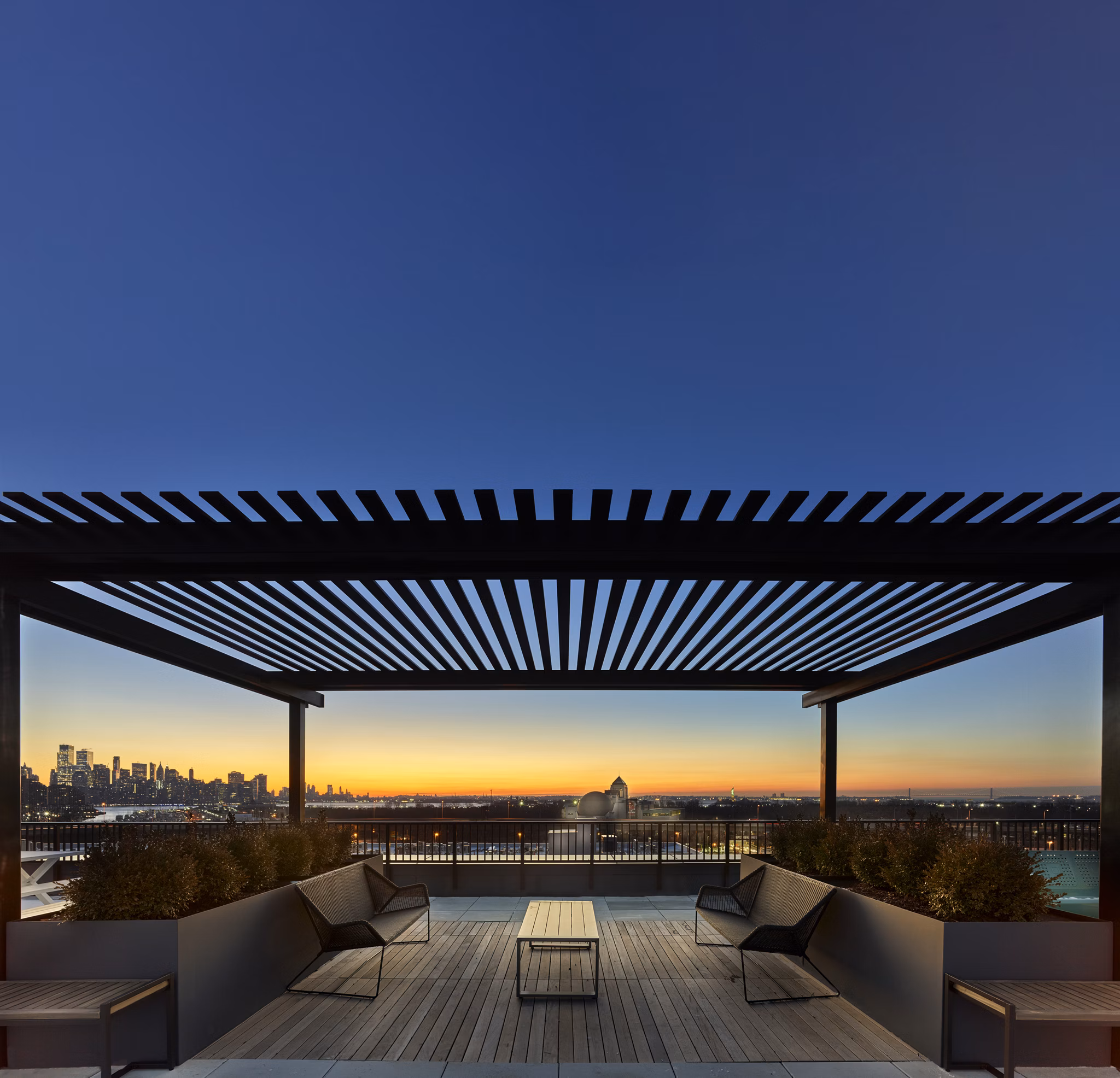 Scenic rooftop deck at BELA Apartments offering luxury relaxation spaces with ocean views in Brooklyn, ideal for Greystar residents