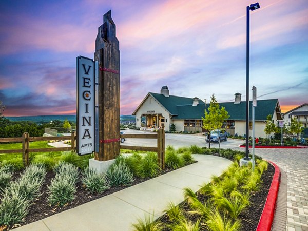 Vecina Apartment Villas signage: Elegant entrance with modern design in a premium residential community