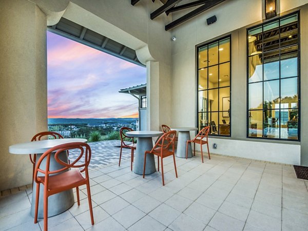 Modern patio with stylish seating at Vecina Apartment Villas, perfect for outdoor relaxation and social gatherings
