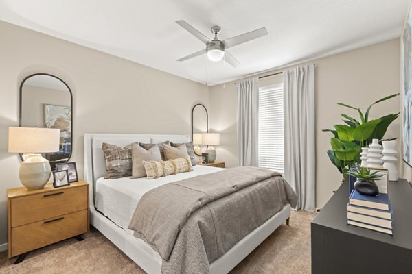 Marlowe South Tampa Apartments: Cozy bedroom with stylish decor and ample natural light