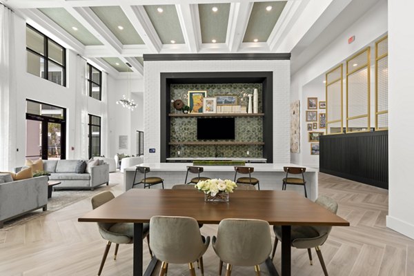 Clubhouse featuring modern design and communal seating at Marlowe South Tampa Apartments
