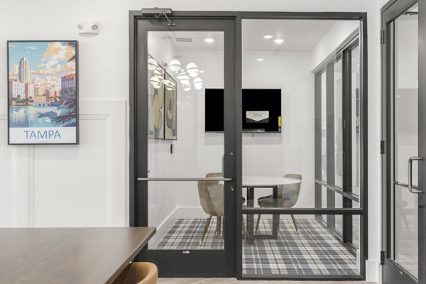 Meeting space with modern amenities at clubhouse in Marlowe South Tampa Apartments, featuring a sleek design ideal for gatherings and events