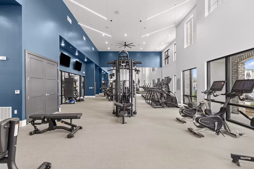State-of-the-art fitness center at Marlowe South Tampa Apartments with modern equipment and spacious workout area