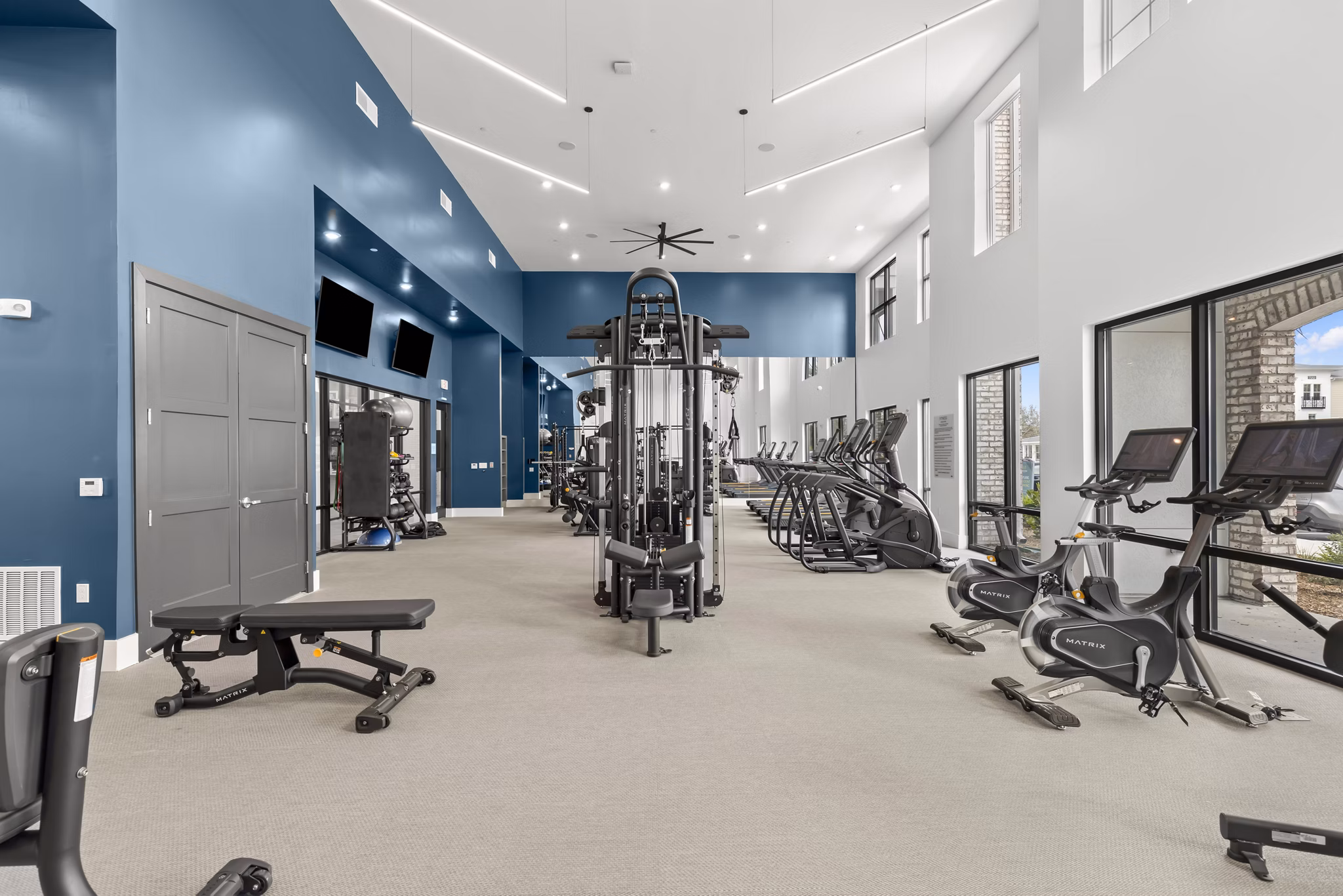 State-of-the-art fitness center at Marlowe South Tampa Apartments with modern equipment and spacious workout area
