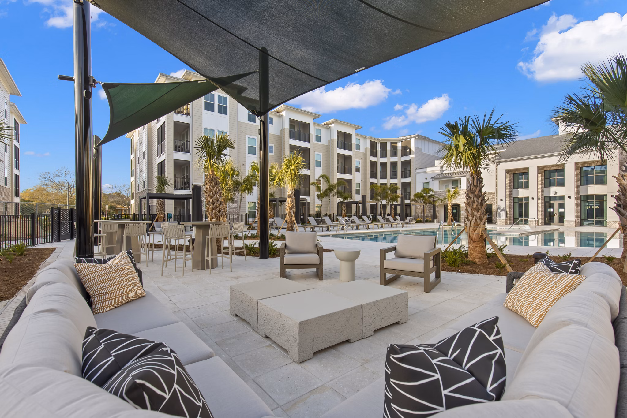 Scenic courtyard with lush landscaping and seating area at Milano Apartments