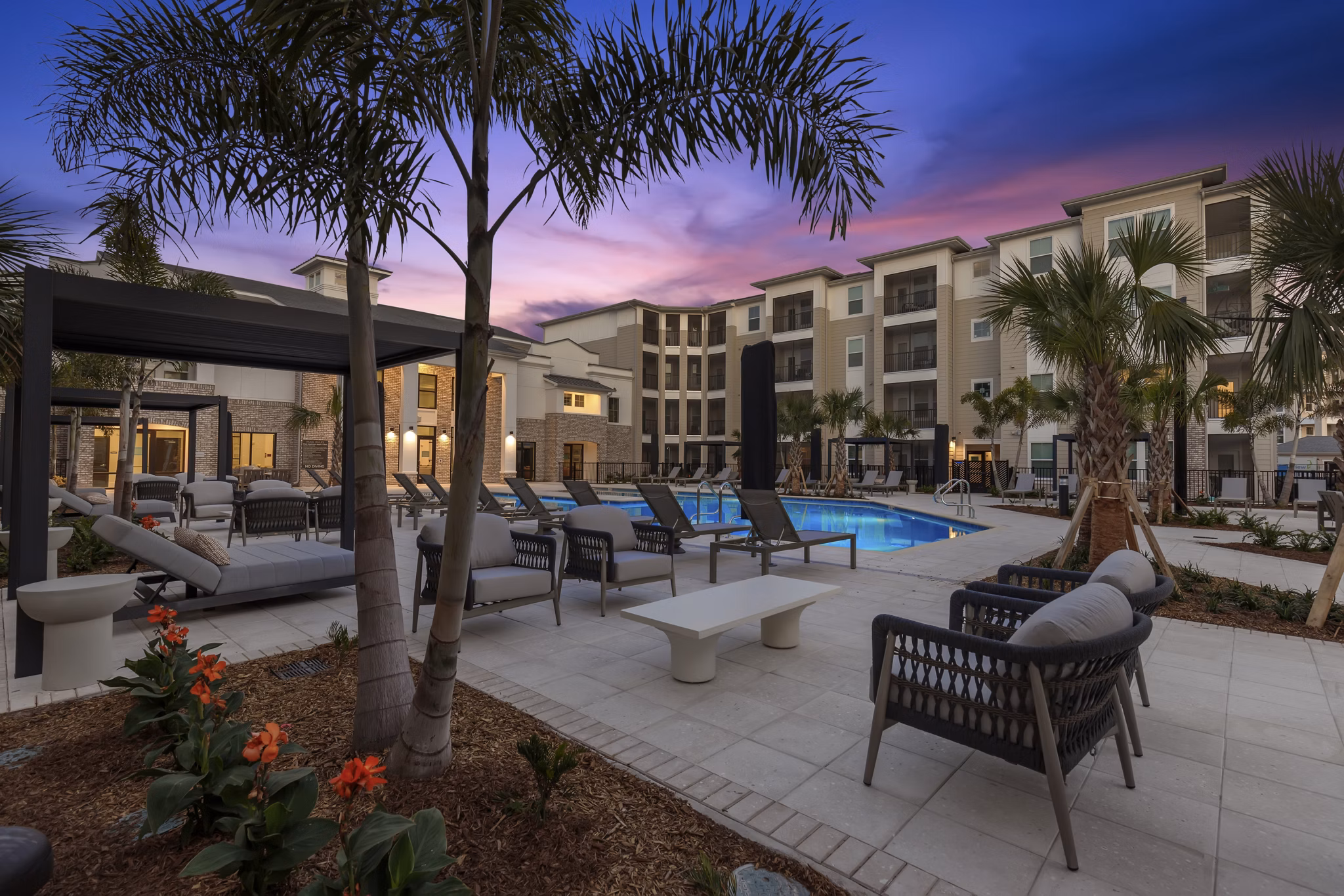 Milano Apartments: Tranquil courtyard with lush greenery and seating areas, offering a serene retreat within the community