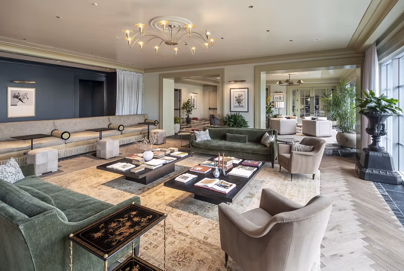 Modern clubhouse with stylish seating and games area at The Commodore Apartments