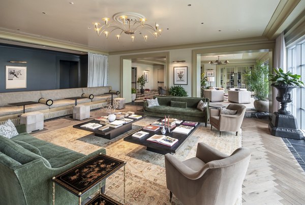 Modern clubhouse with stylish seating and games area at The Commodore Apartments