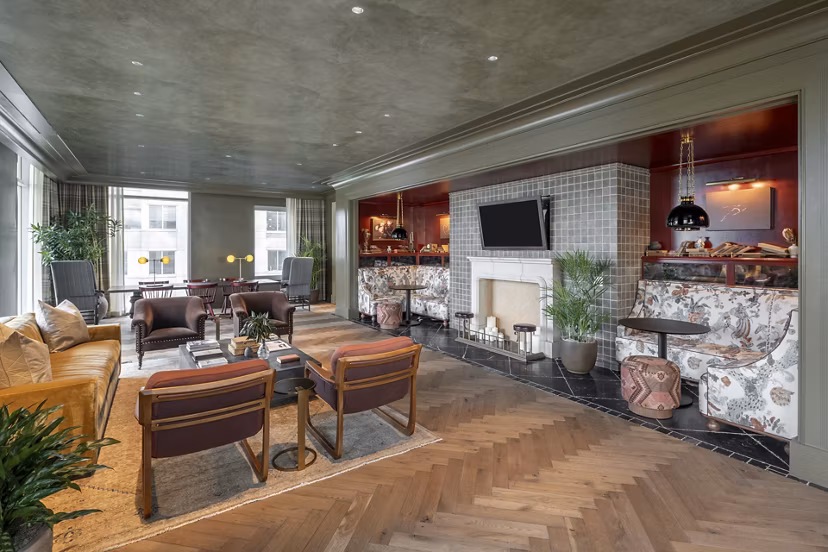 Clubhouse with stylish decor and seating at The Commodore Apartments, perfect for social gatherings and community events