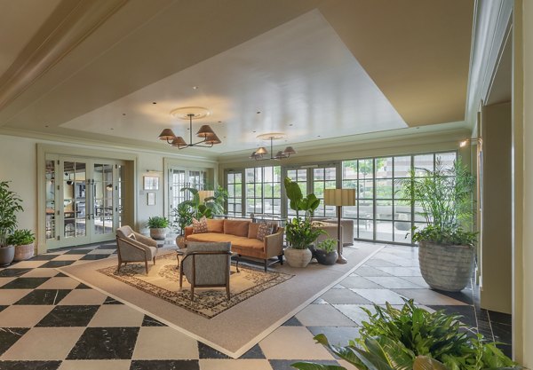 Elegant clubhouse with modern decor at The Commodore Apartments, ideal for social gatherings and relaxation