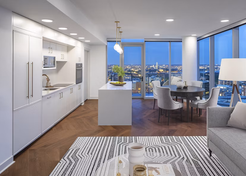 Modern kitchen with stainless steel appliances at The Commodore Apartments